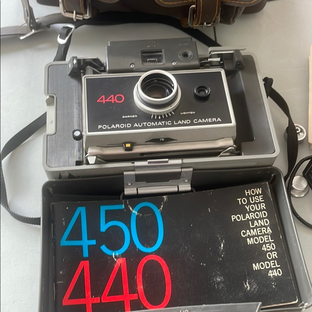 Polaroid Black Film Camera with Classic Design and Instant Photography